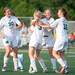 Father Gabriel Richard celebrates after Kaitlyn Conway   scores a goal during the first half of the regional semifinal game, Wednesday, May 29.
Courtney Sacco I AnnArbor.com  
